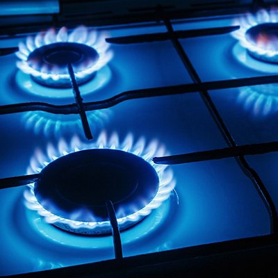 Blue flames of gas burning from a kitchen gas stove 