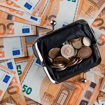 Financial concept with coins in purse on banknote and plaster background flat lay. Financial concept with coins in purse on banknote and plaster background flat lay.