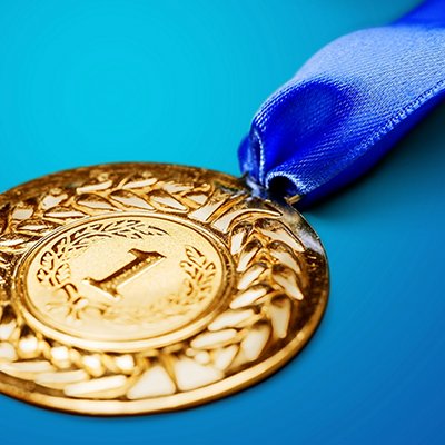 Gold medal with  ribbon on background