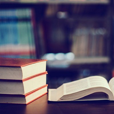 Book in library with open textbook,education learning concept Book in library with open textbook,education learning concept