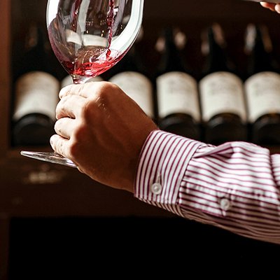 Handsome young sommelier at the wine shop