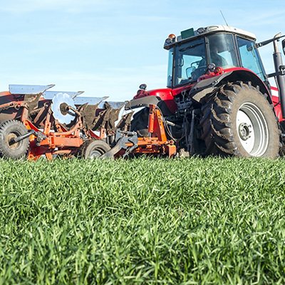 Tractor agricultural machine cultivating field. Tractor agricultural machine cultivating field.