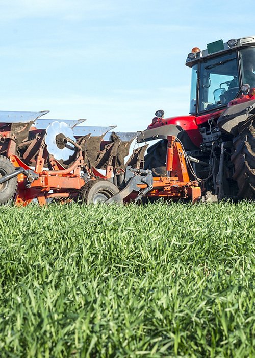 Tractor agricultural machine cultivating field. Tractor agricultural machine cultivating field.