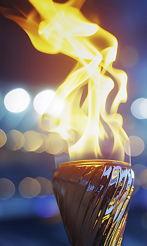 Burning torch close-up with broken background. Fire concept