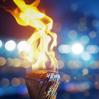 Burning torch close-up with broken background. Fire concept