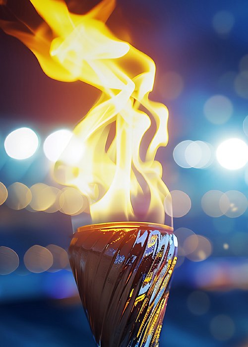 Burning torch close-up with broken background. Fire concept
