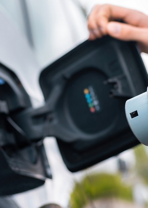 Man charging electric car