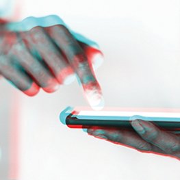 Hand and futuristic smartphone in double color exposure effect Hand and futuristic smartphone in double color exposure effect