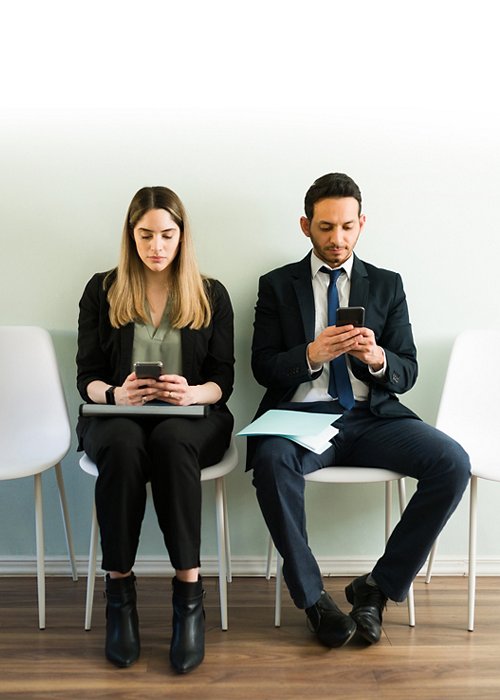 Business colleagues waiting to enter a job interview
