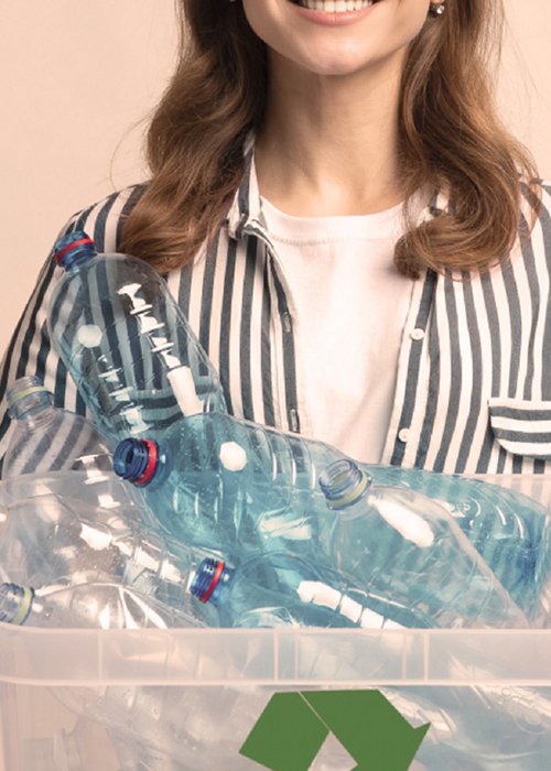 Girl holding plastic bottles