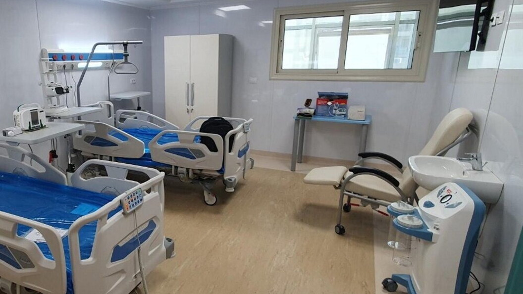 A hospital room equipped with modern beds and medical equipment