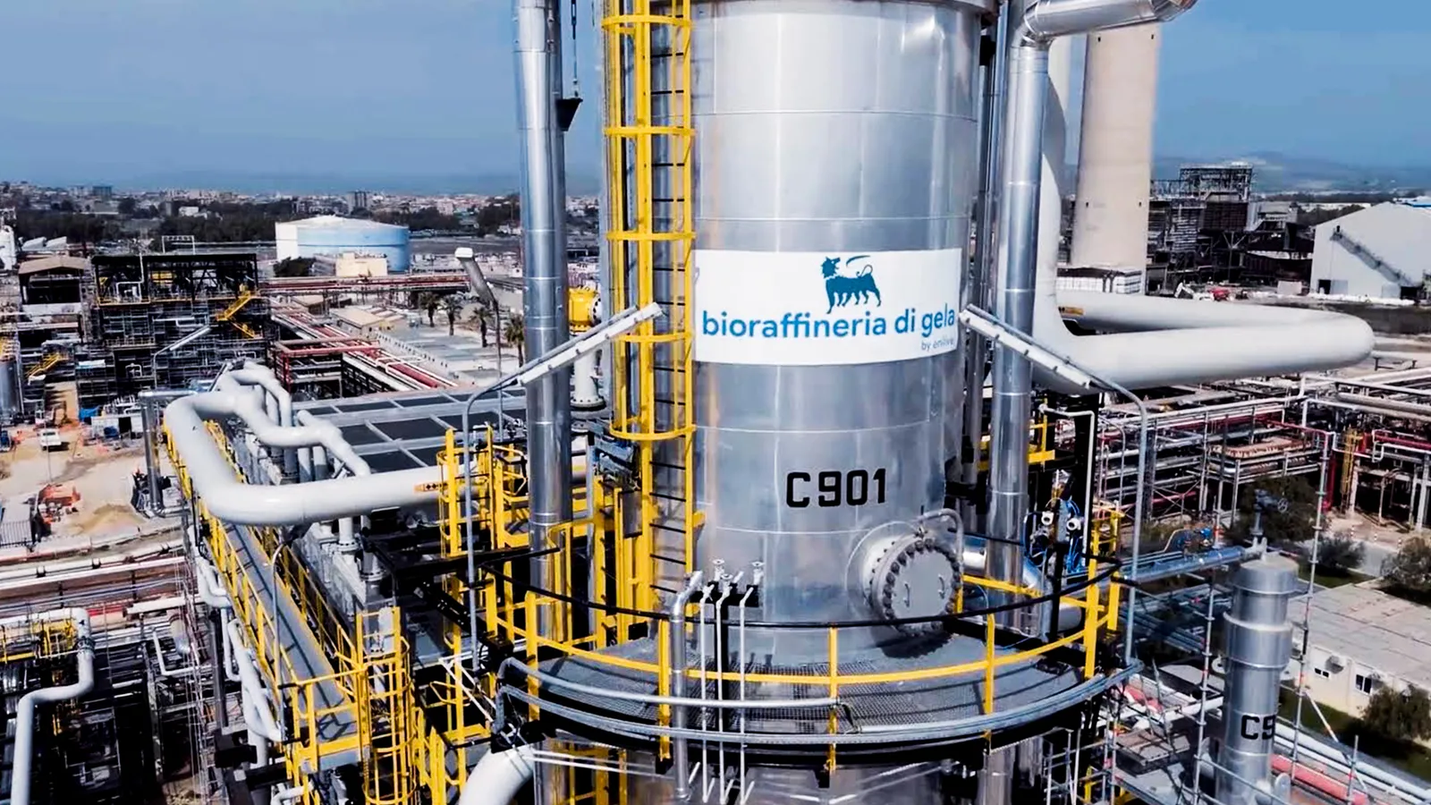 Metal structure with industrial pipes and walkways at the Gela biorefinery in Sicily.